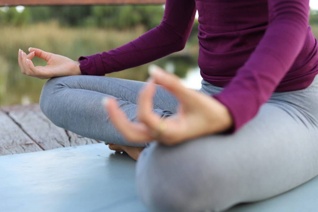 Meditating seated with gyan mudra